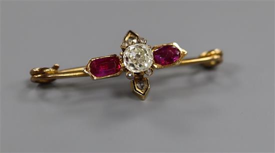 A late Victorian yellow metal, ruby and diamond cluster stick pin head, now converted to a brooch, 34mm.